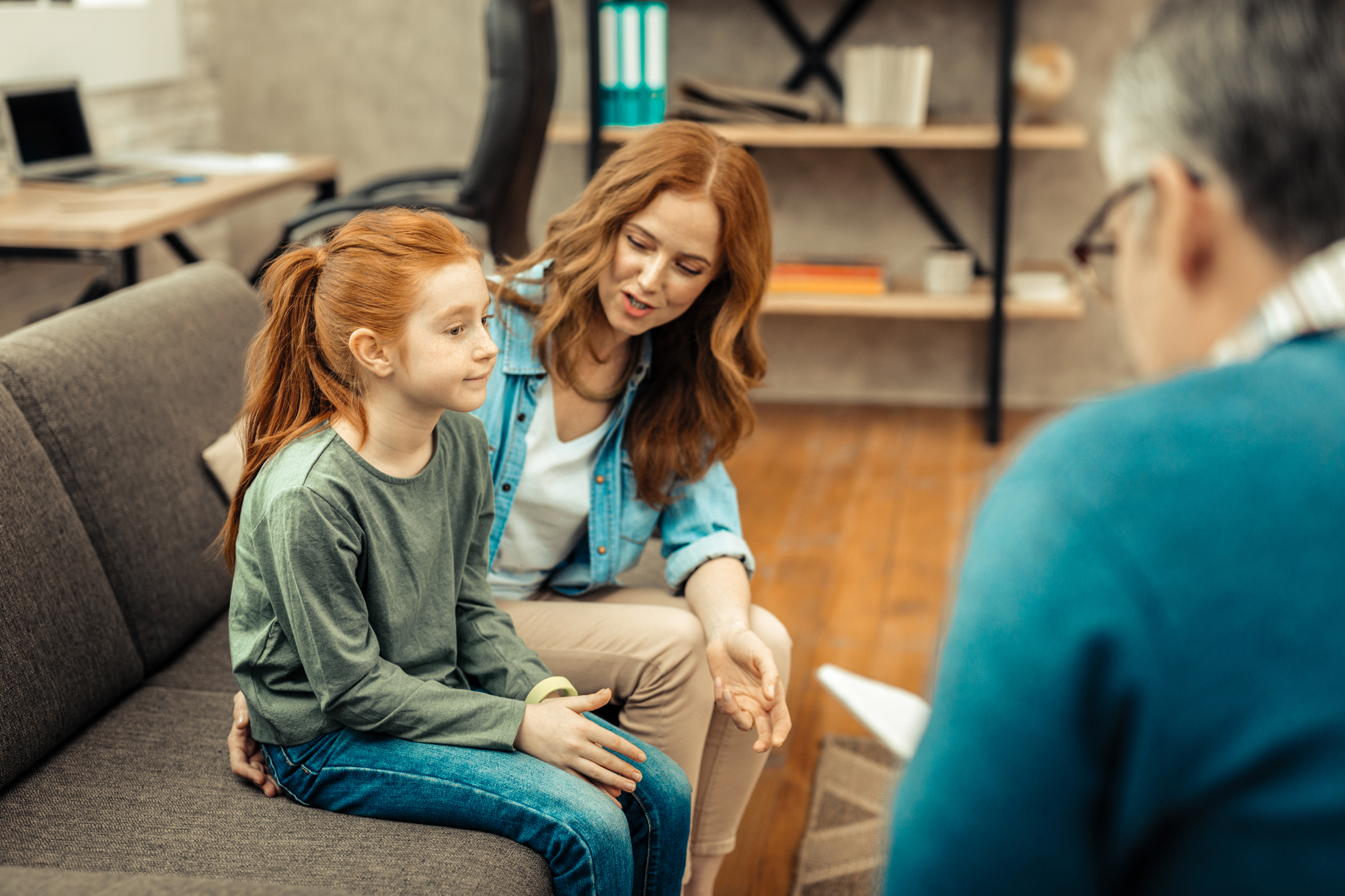 Mom and daughter with mental health professional